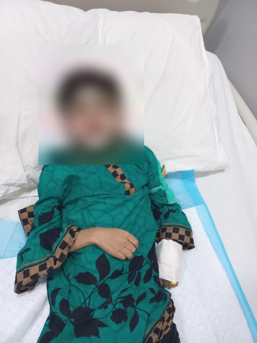 A patient resting on the ward during a supported course of treatment.
